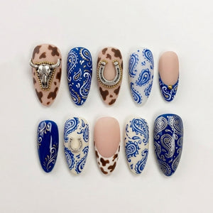 Western Cowgirl Press-On Nails | Handmade Blue Bandana Paisley & Cow Print Fake Nails Set | Metallic Bull Skull Charm Almond Reusable Gel Nails